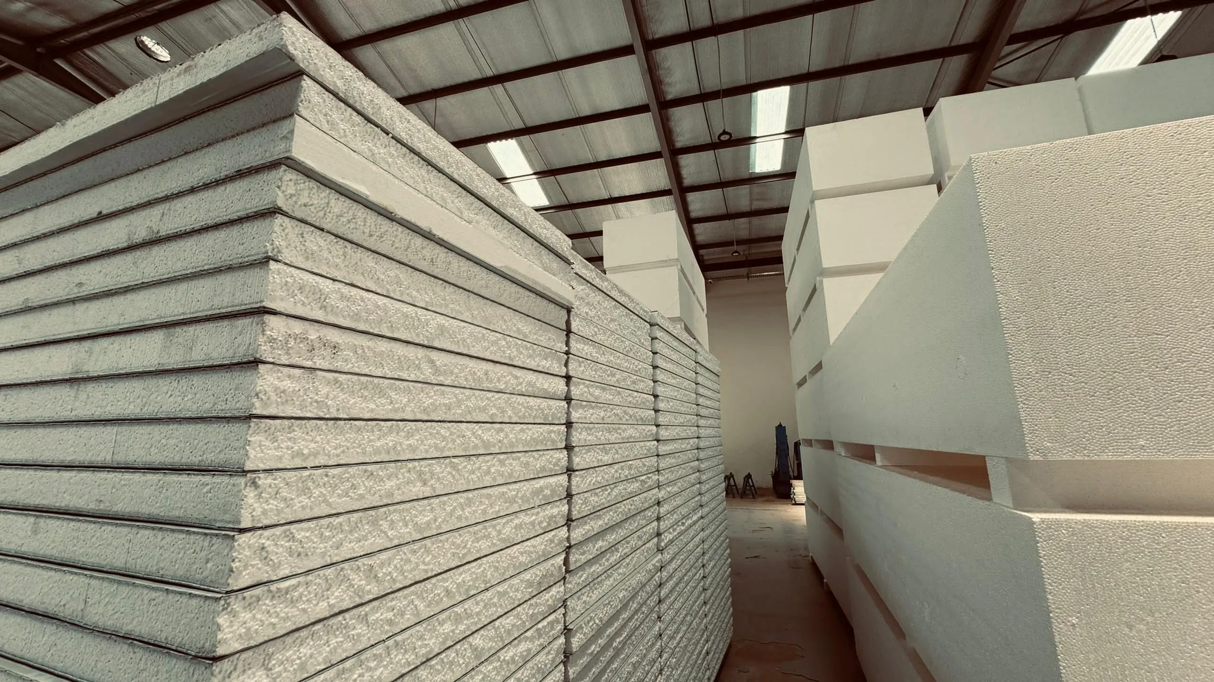Aisle of ready-to-ship sandwich panels in the SPECO warehouse, Juba