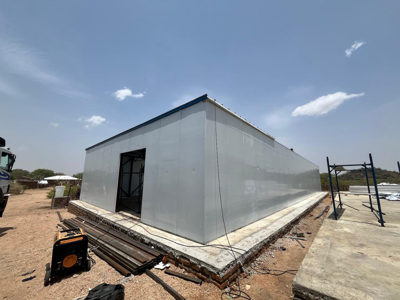 MSF warehouse, Tujur: Full completed warehouse structure standing on remote site