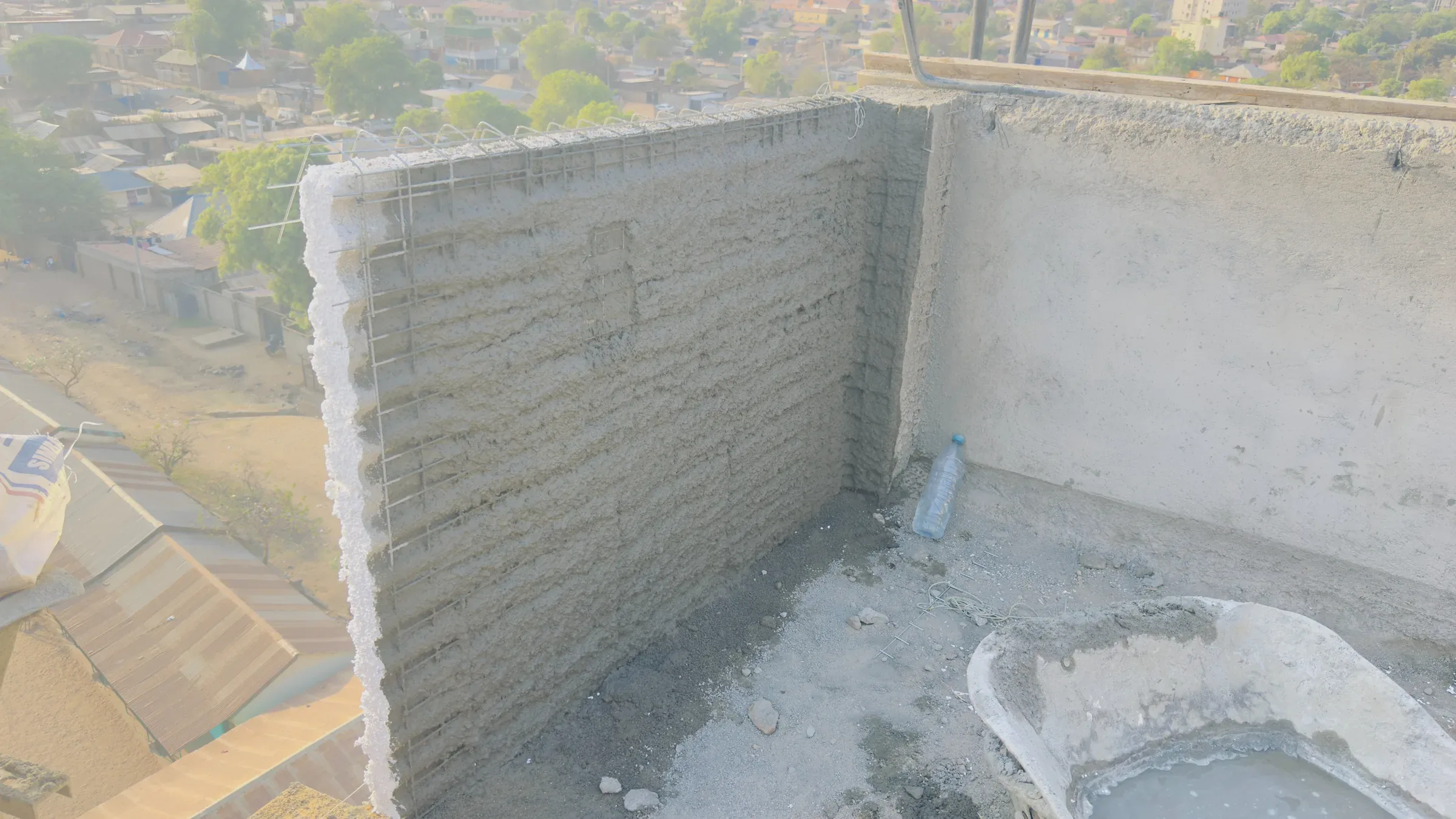 H Brothers G+6 tower, Katoor, Juba: rooftop wall plaster over EPS panels