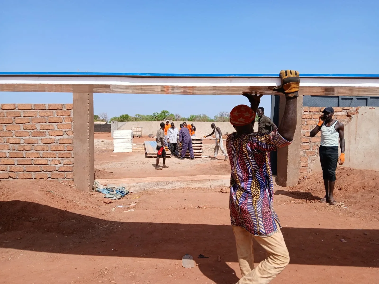 MSF warehouse, Tujur: roof panel lifted into place